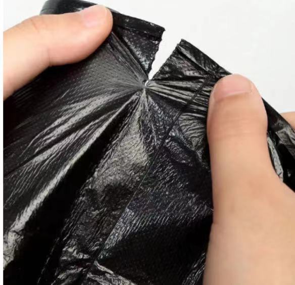 HDPE Black Star Sealed Garbage Bags On Roll With Embossing HDPE Black Star Sealed Garbage Bags On Roll With Embossing